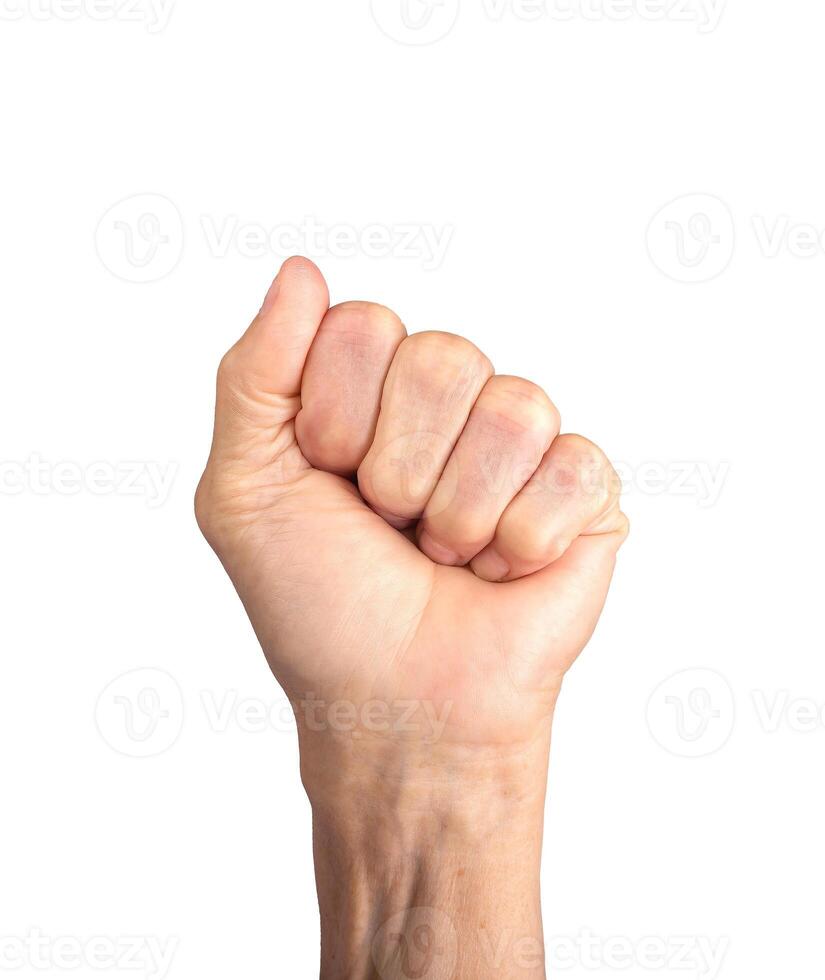 Fist gesture. Elderly Caucasian woman s wrinkled hand clenched tightly, symbolizing strength, photo