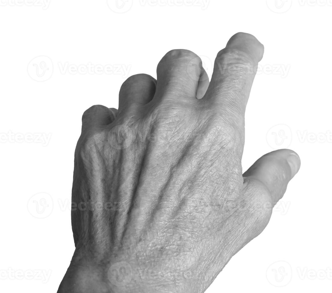 Pointing and reaching gesture. Senior Caucasian woman s wrinkled left hand with fingers extended, photo