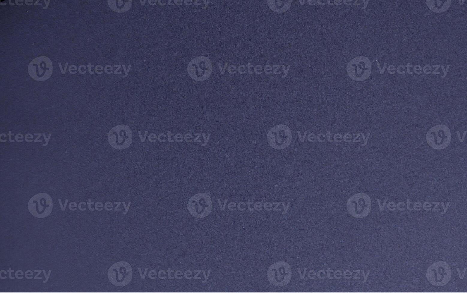 Midnight blue paper background with a smooth, matte surface and subtle grainy texture. Bold dark photo