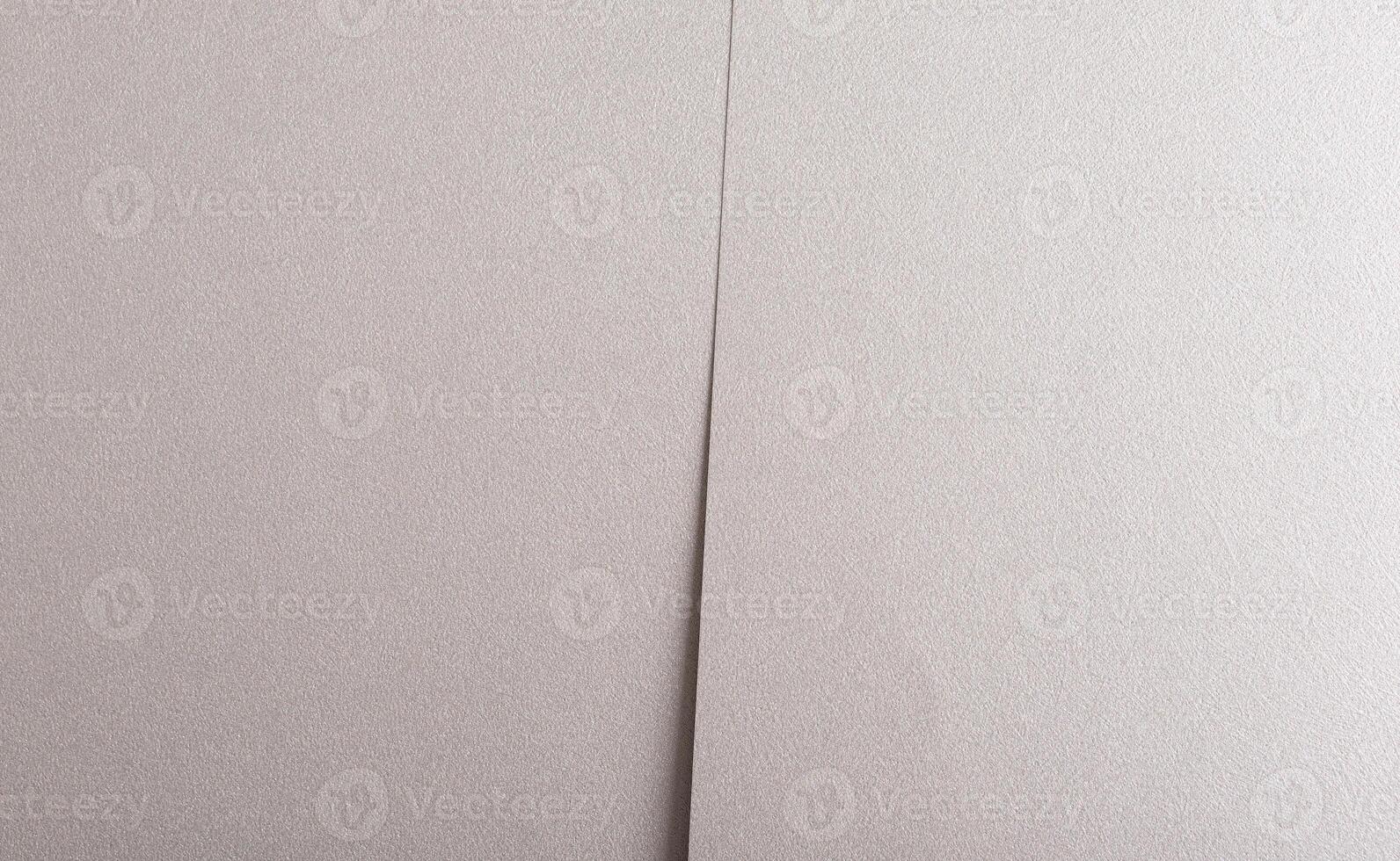 Gray paper background with a metallic, pearlescent finish and overlapping layers. Soft neutral tones photo