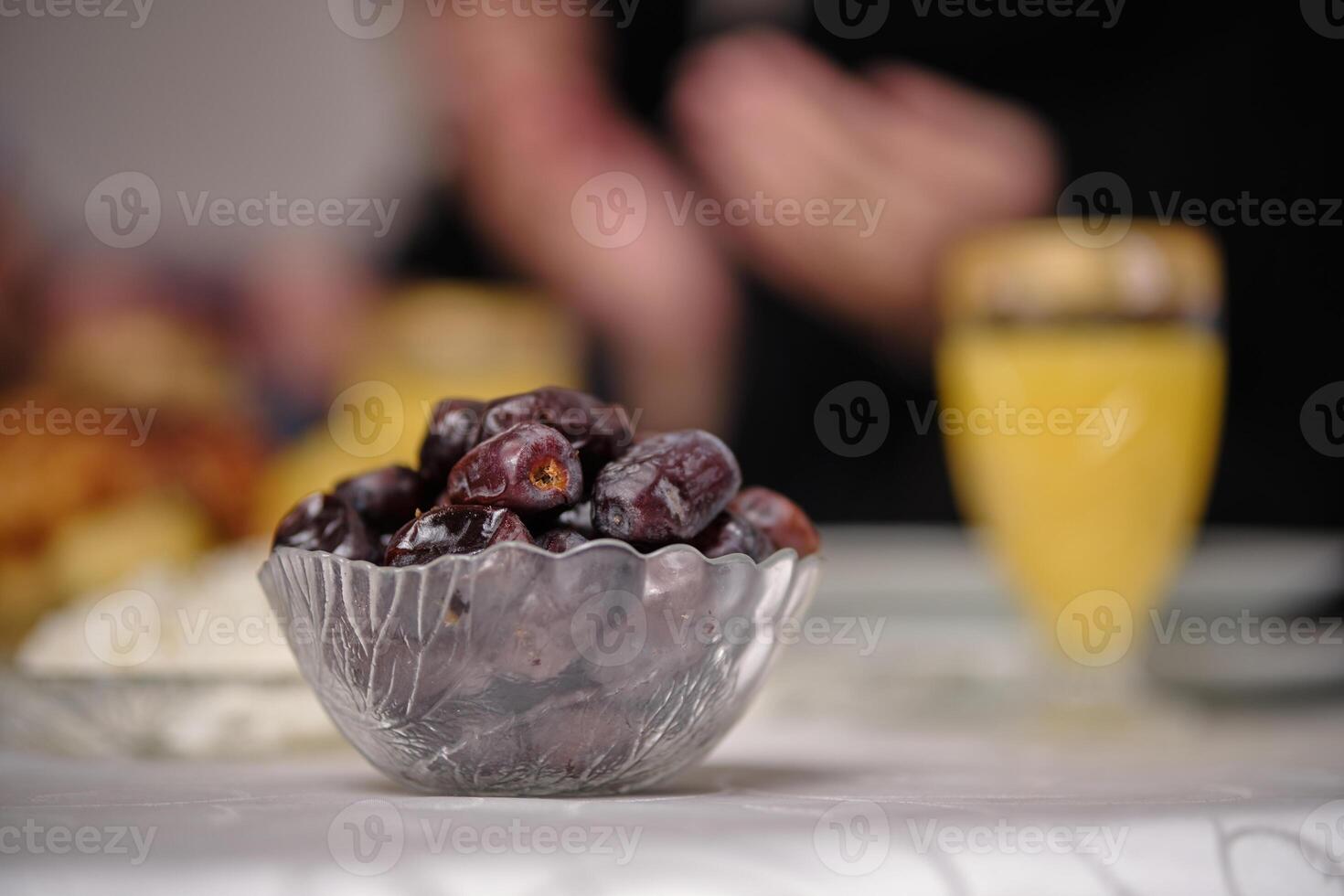 Eid mubarak Ramadan focus on a bowl of dates at the dining table at home. photo