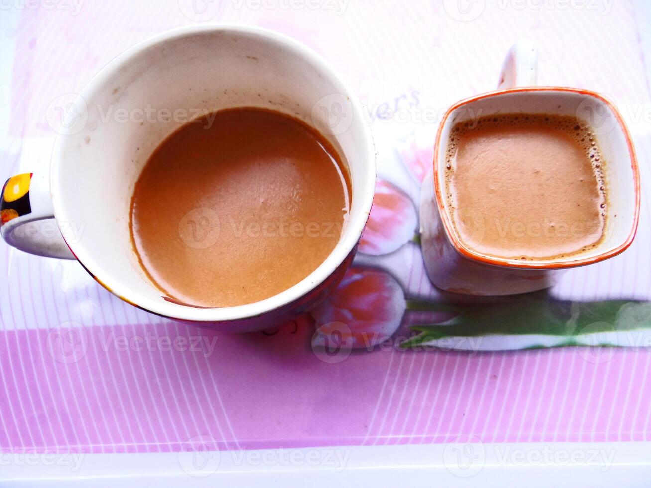 A cup of coffee and a cup of tea photo