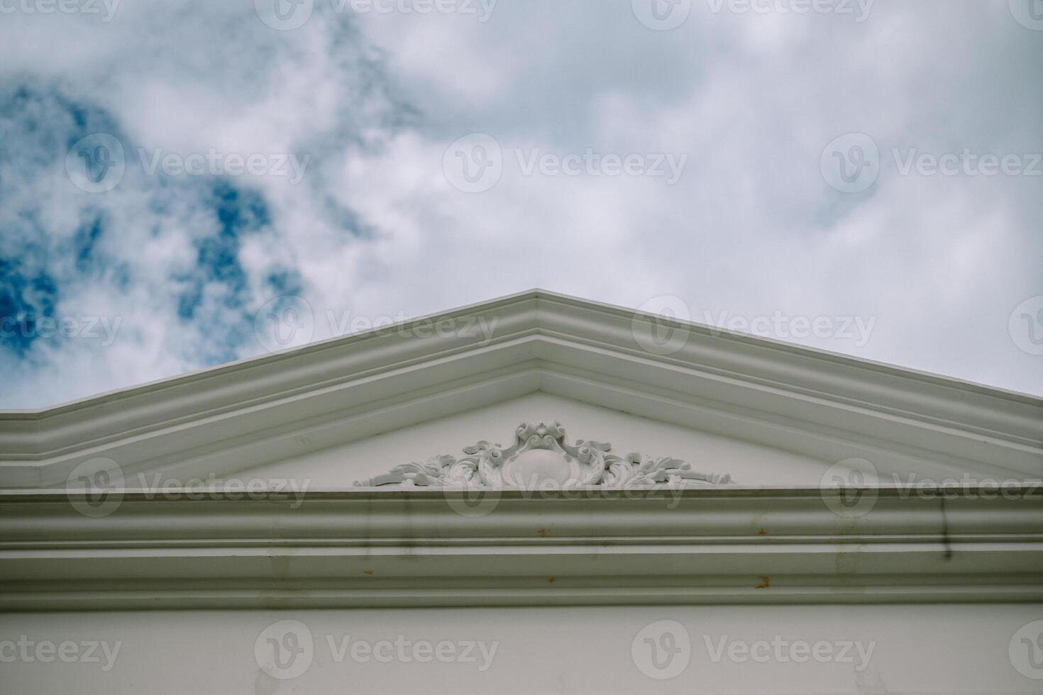 White triangular pediment with ornate details so nice photo