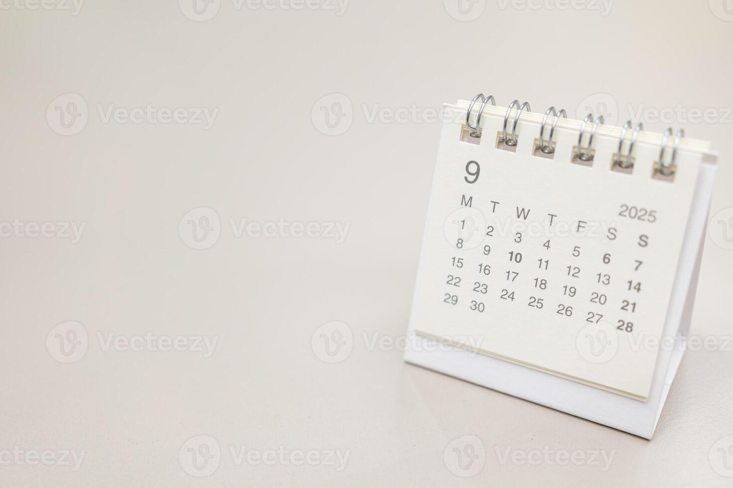 Simple desk calendar for SEPTEMBER 2025 background. Calendar concept with copy space. 2025 SEP calendar. photo