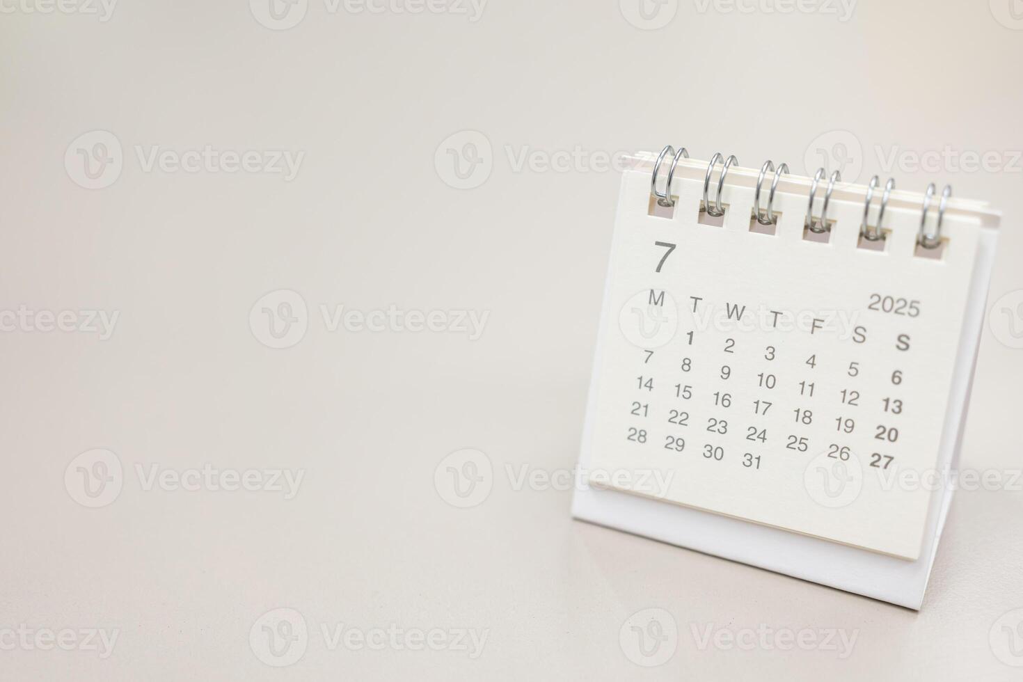Simple desk calendar for JULY 2025 background. Calendar concept with copy space. 2025 JUL calendar. photo