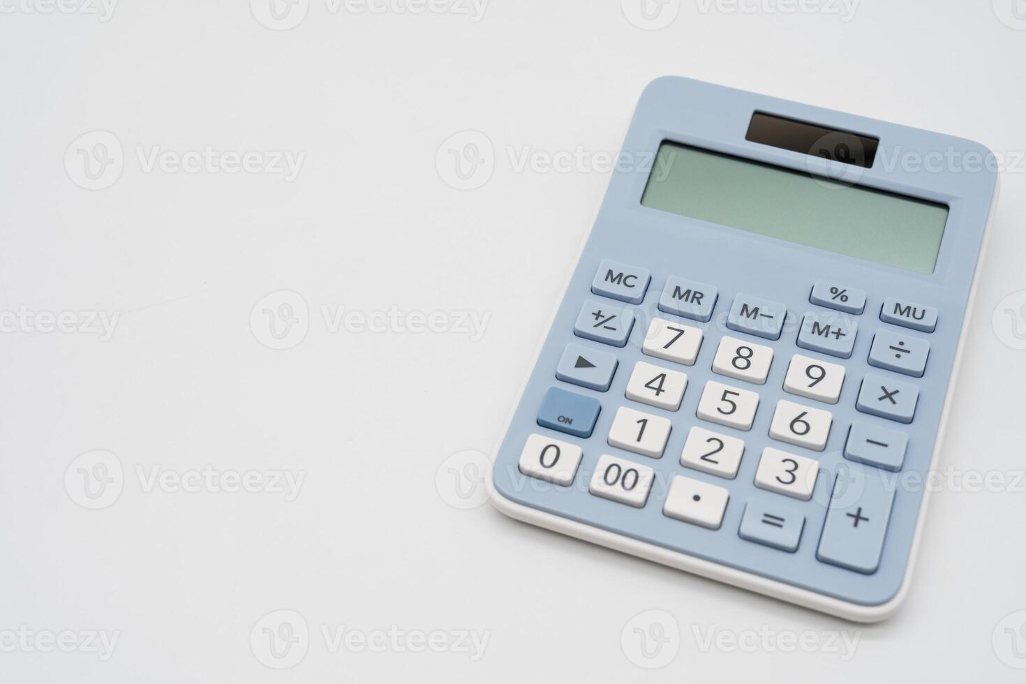 Light blue digital calculator on isolated background. Device for calculating the numbers. Copy Space. photo