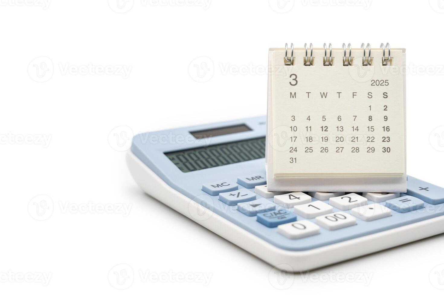 Simple desk calendar for MARCH 2025 on calculator. Calendar concept with copy space. 2025 MAR calendar. calculator and forecast for finances in 2025. Money, Budget, tax, investment and financial. photo