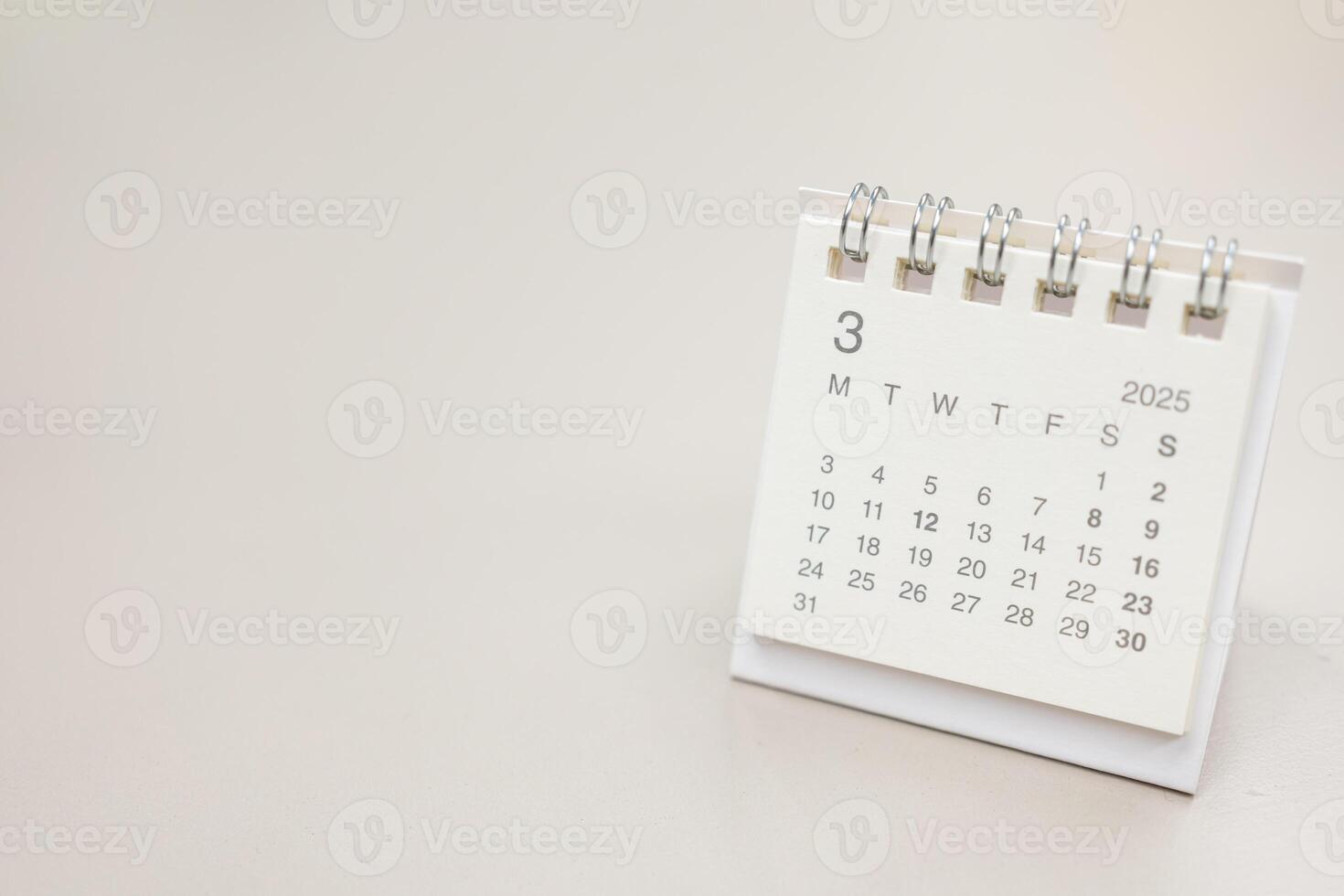 Simple desk calendar for MARCH 2025 background. Calendar concept with copy space. 2025 MAR calendar. photo