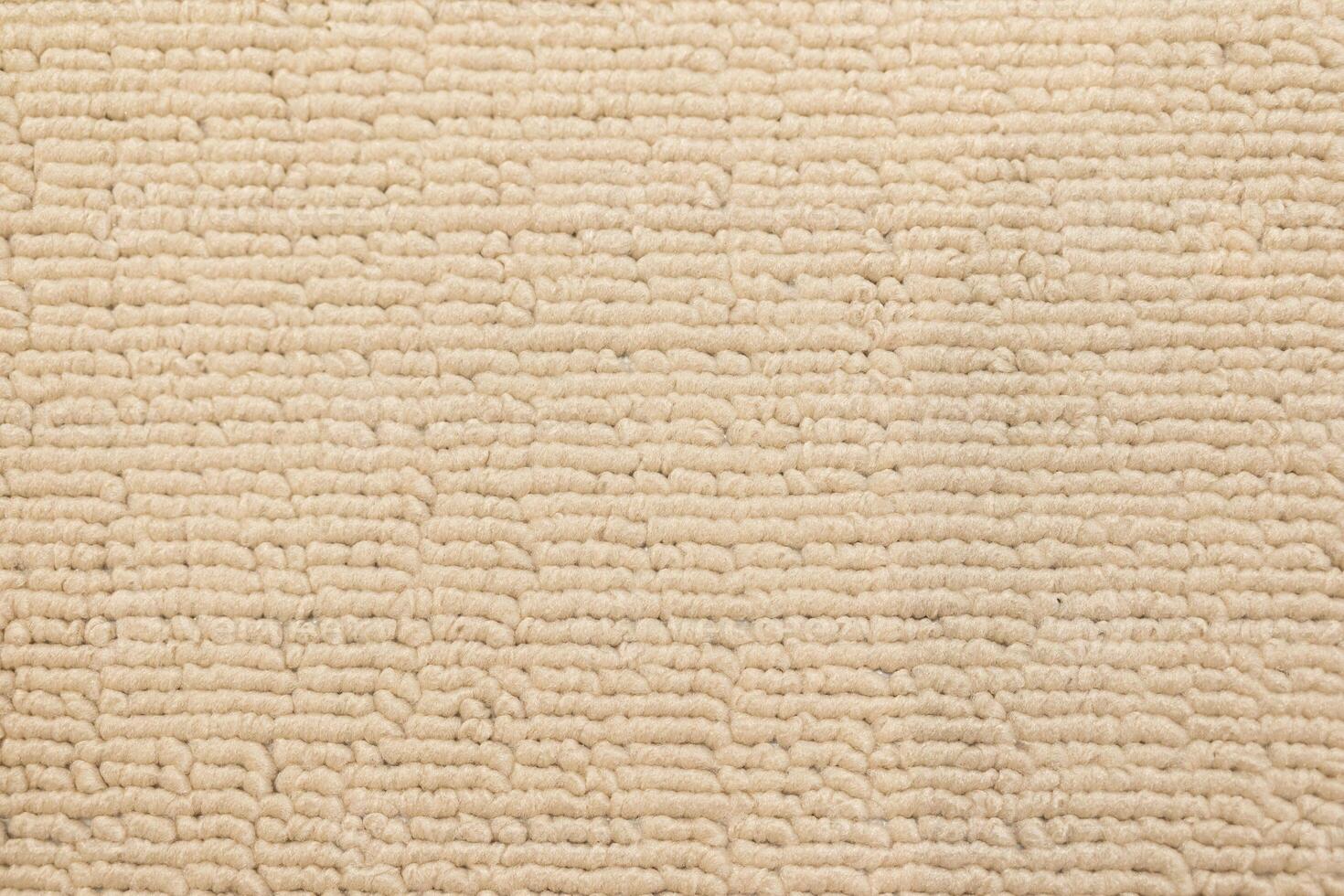 Close up of Cream colored Textured Fabric. Beige Textured Material. Textured Fabric Background. photo