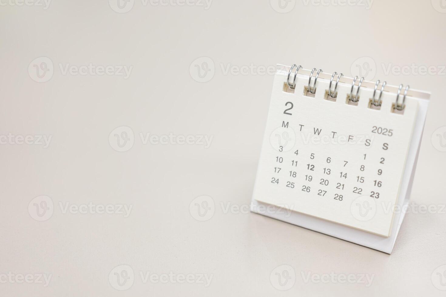 Simple desk calendar for 2025 FEBRUARY background. Calendar concept with copy space. 2025 FEB calendar. photo