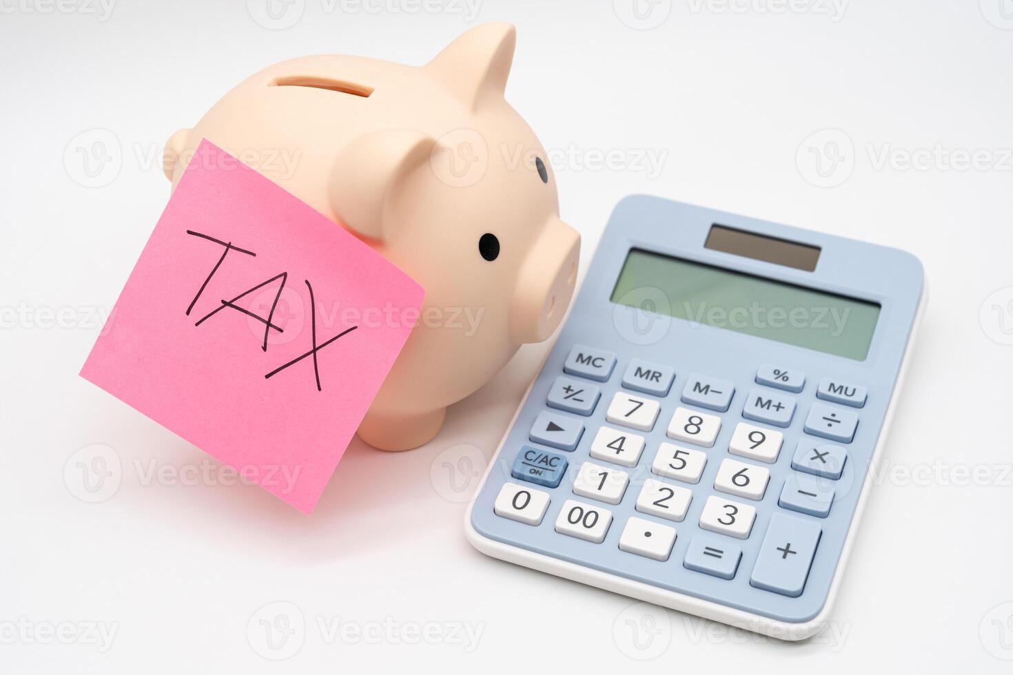 Tax Sticky note with piggy bank and calculator, Saving money for tax. Budget, tax, investment, financial, savings. Copy space. photo