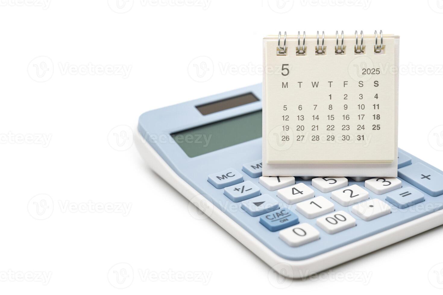 Simple desk calendar for MAY 2025 on calculator. Calendar concept with copy space. 2025 MAY calendar. calculator and forecast for finances in 2025. Money, Budget, tax, investment and financial. photo