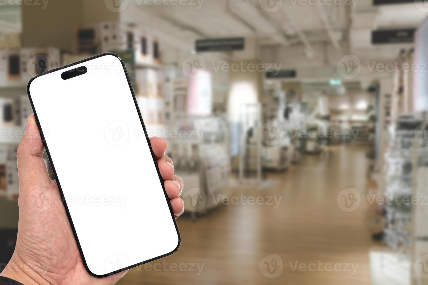 Mockup blank screen mobile phone for app or web site mockup. Smart phone with white screen in hand on Blur furniture store photo
