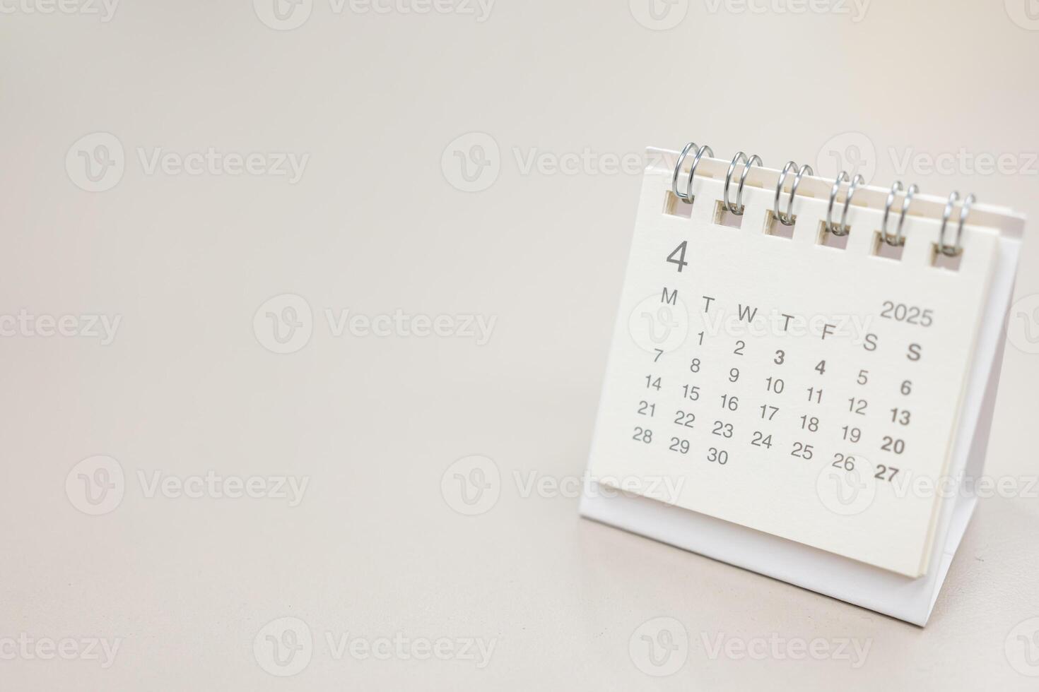 Simple desk calendar for 2025 APRIL background. Calendar concept with copy space. 2025 APR calendar. APRIL. photo
