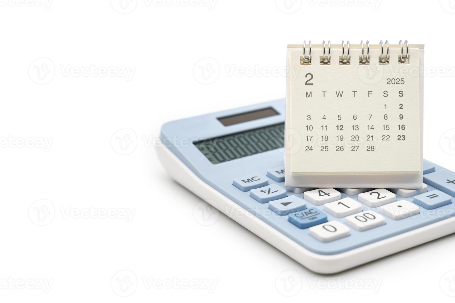 Simple desk calendar for FEBRUARY 2025 on calculator. Calendar concept with copy space. 2025 FEB calendar. calculator and forecast for finances in 2025. Money, Budget, tax, investment and financial. photo