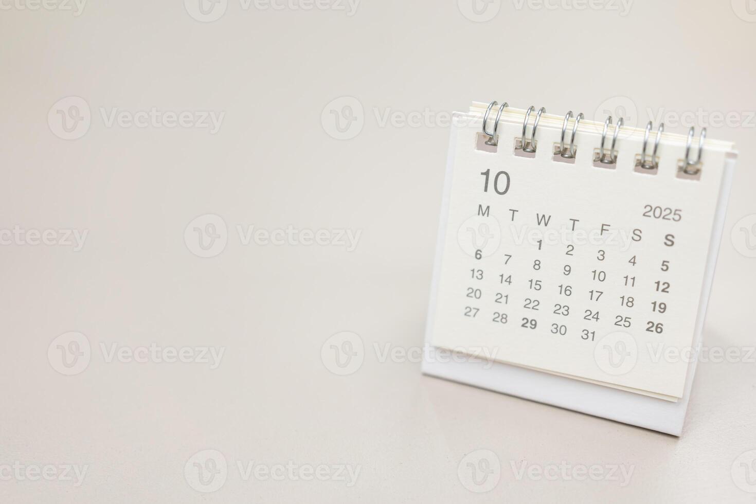 Simple desk calendar for 2025 OCTOBER background. Calendar concept with copy space. 2025 OCT calendar. monthly calendar. photo