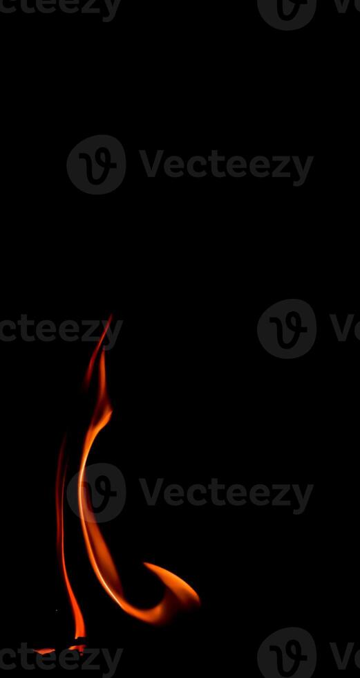 Fire flame isolated on black background. Space for copy photo