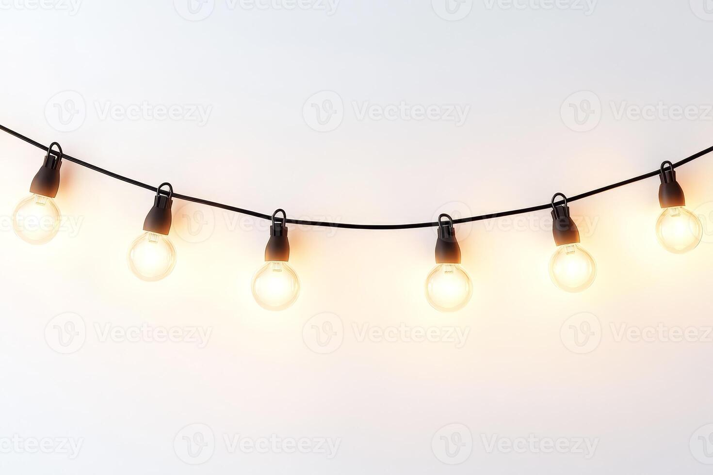 String of Warm White Edison Bulb Lights Hanging Against a Minimalist White Background photo
