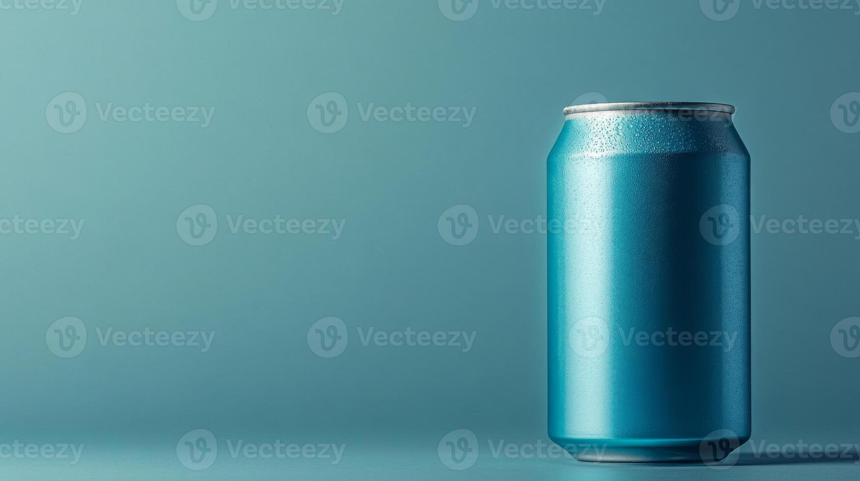 A can of soda is sitting on a table photo