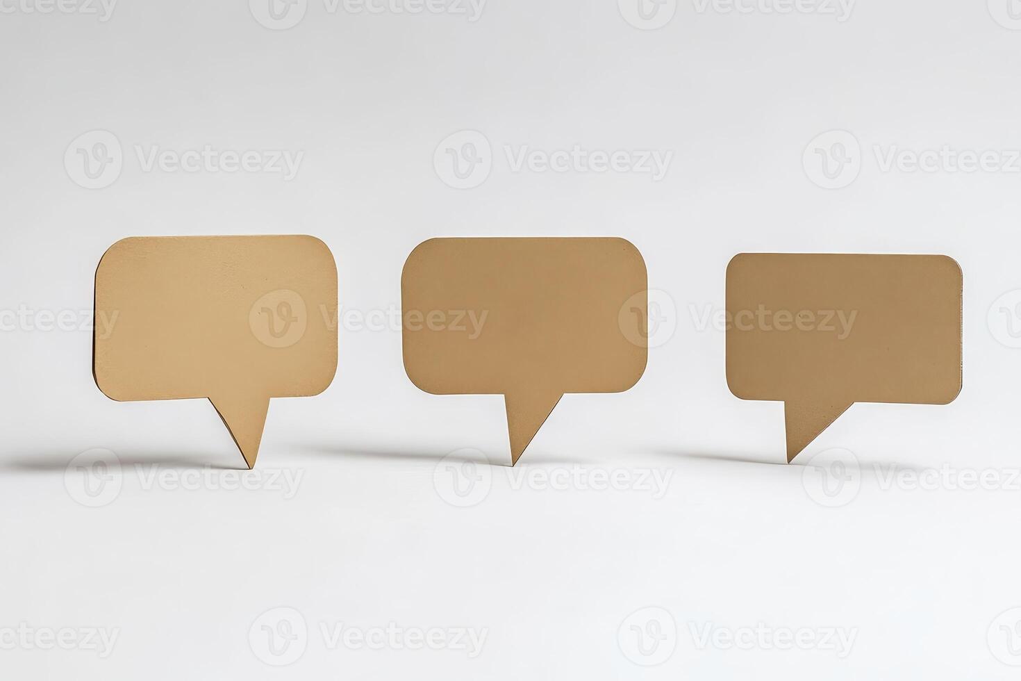 Three paper cutouts of speech bubbles are on a white background photo