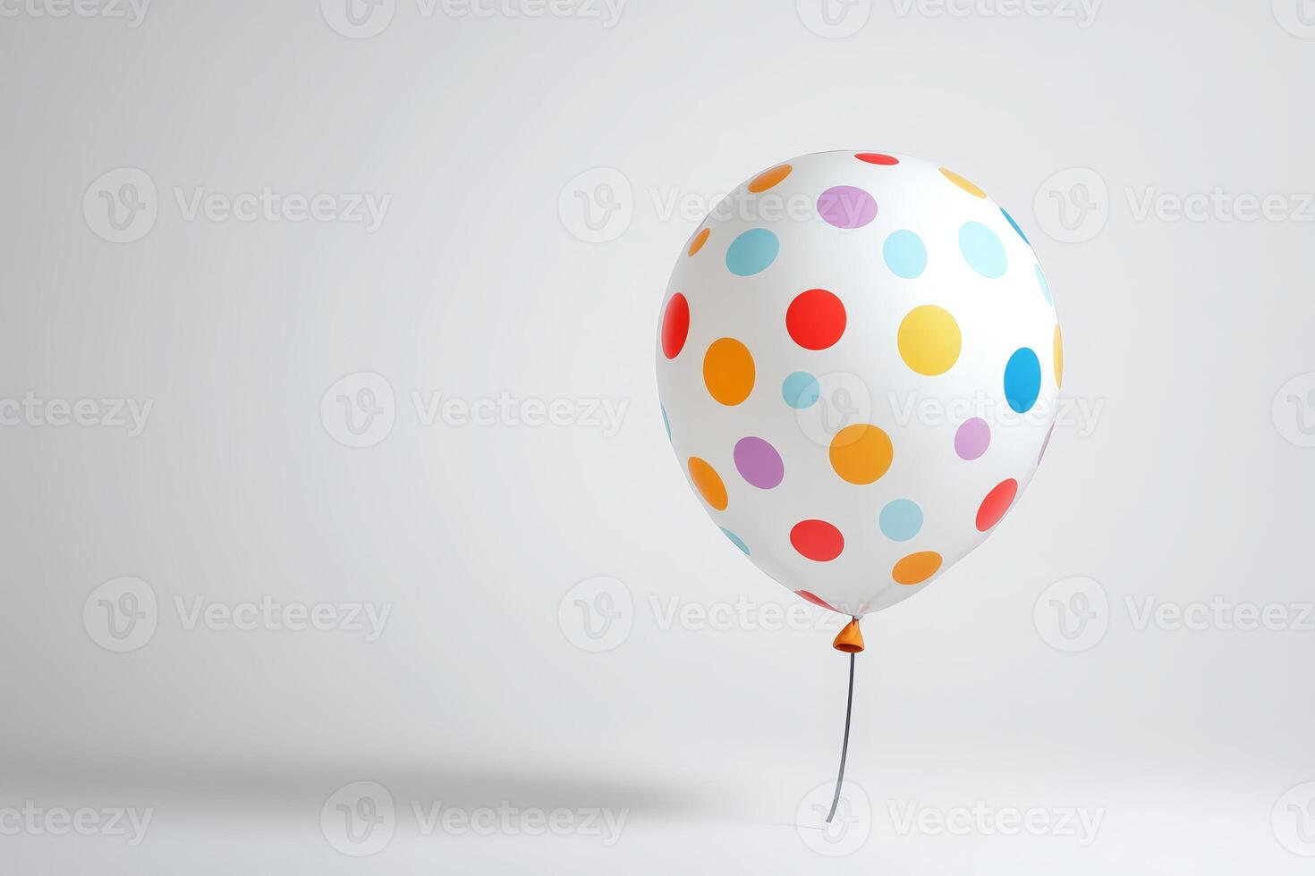 Colorful Polka Dot Balloon on Minimalist Background for Celebrations and Parties photo