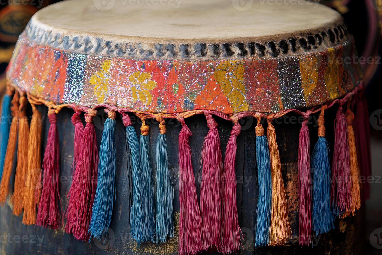 Vibrant Traditional Drum with Colorful Tassels and Intricate Patterns in Close-Up View photo