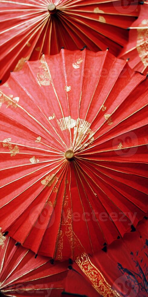 A group of red umbrellas with gold accents photo