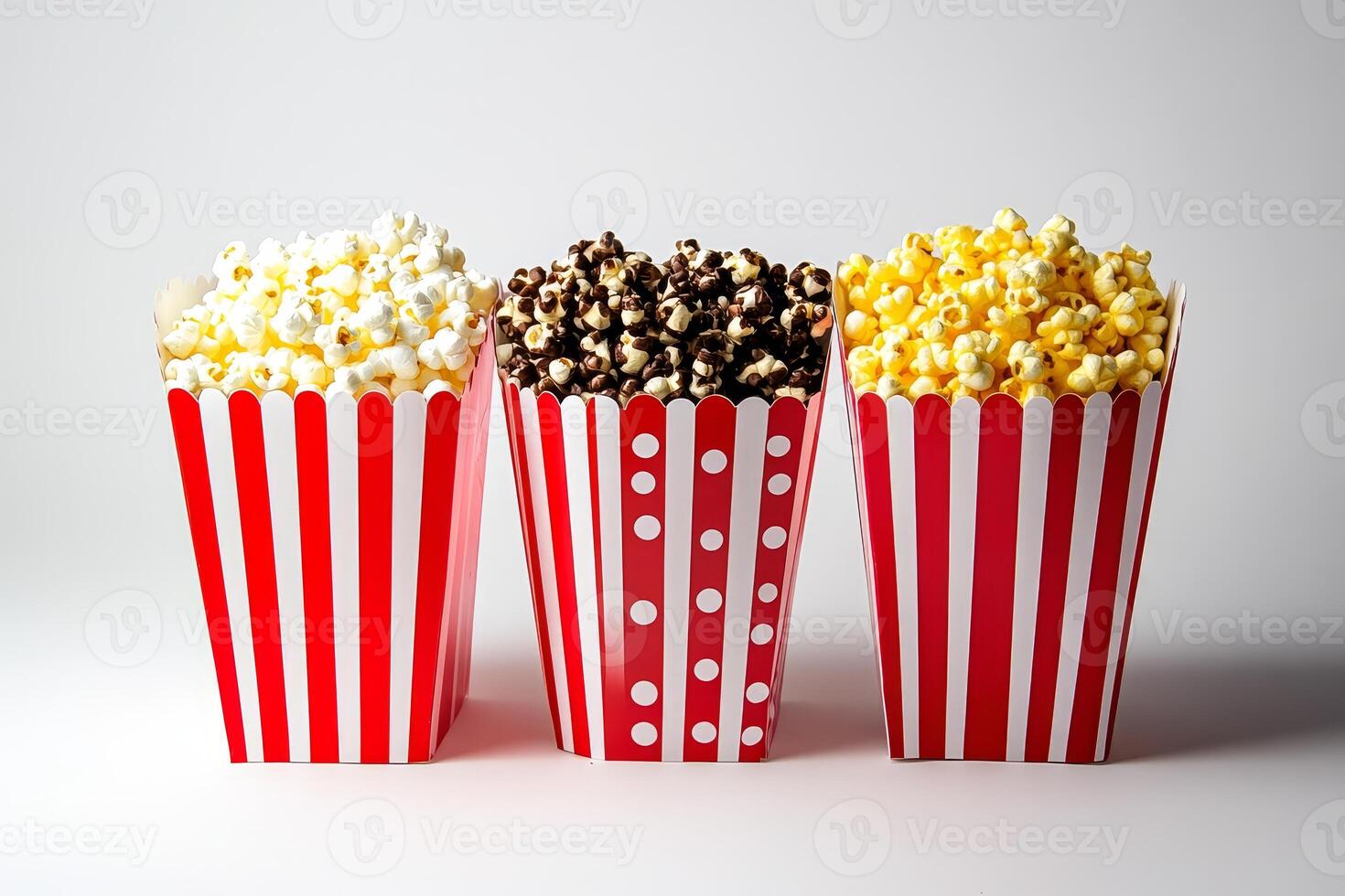 Three red and white popcorn boxes photo