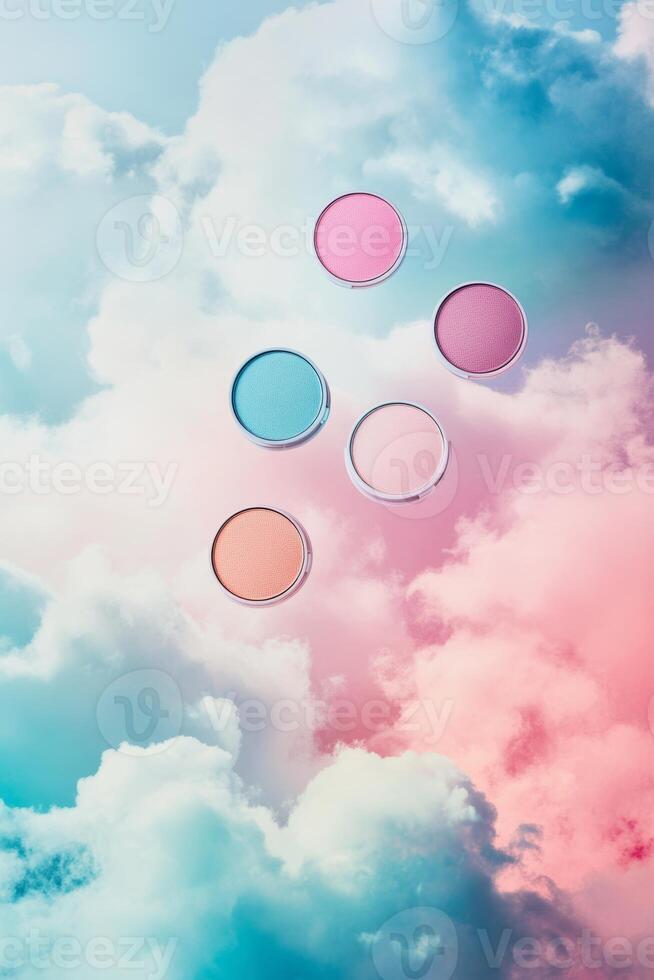 A group of colorful makeup palettes are suspended in the air above a cloudy sky photo