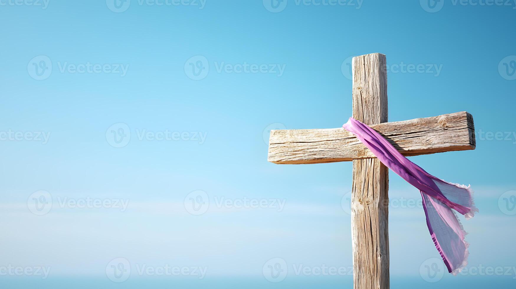 Wooden cross with a purple scarf tied to it photo