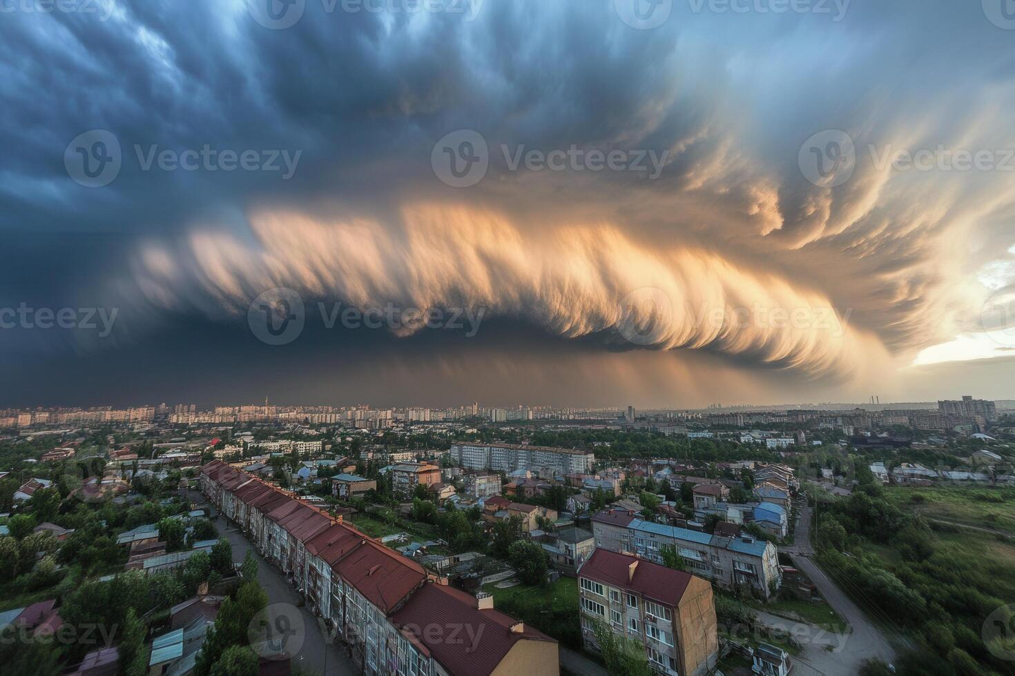 A large storm cloud is seen over a city photo