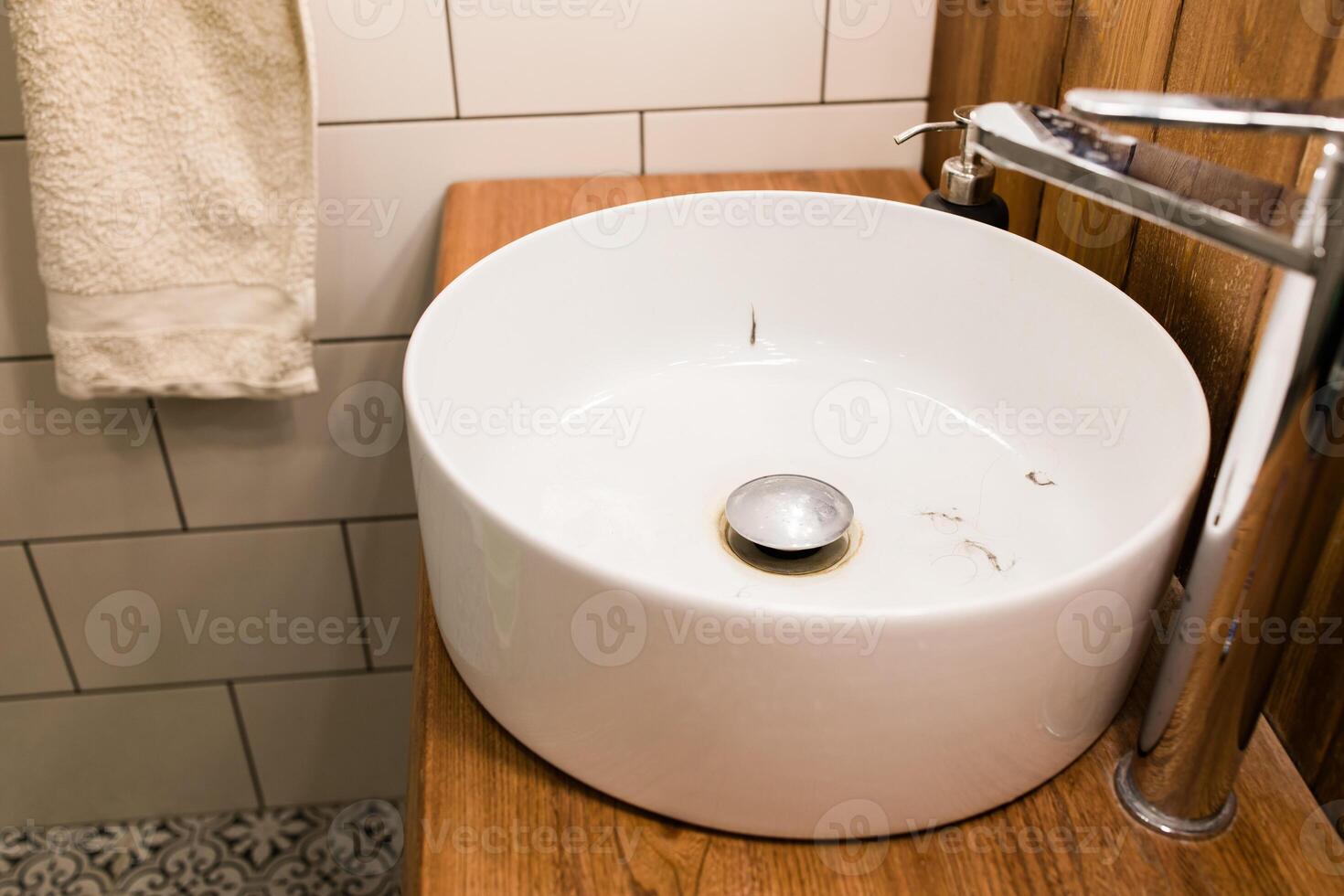 Water tap with dirty sink close up. chrome faucet wash basin. Hygiene and Cleaning hands and messy home concept. photo
