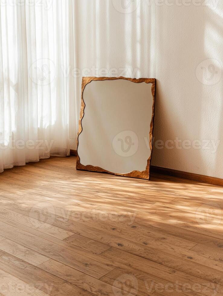 Stylish gold mirror in a sunlit room photo