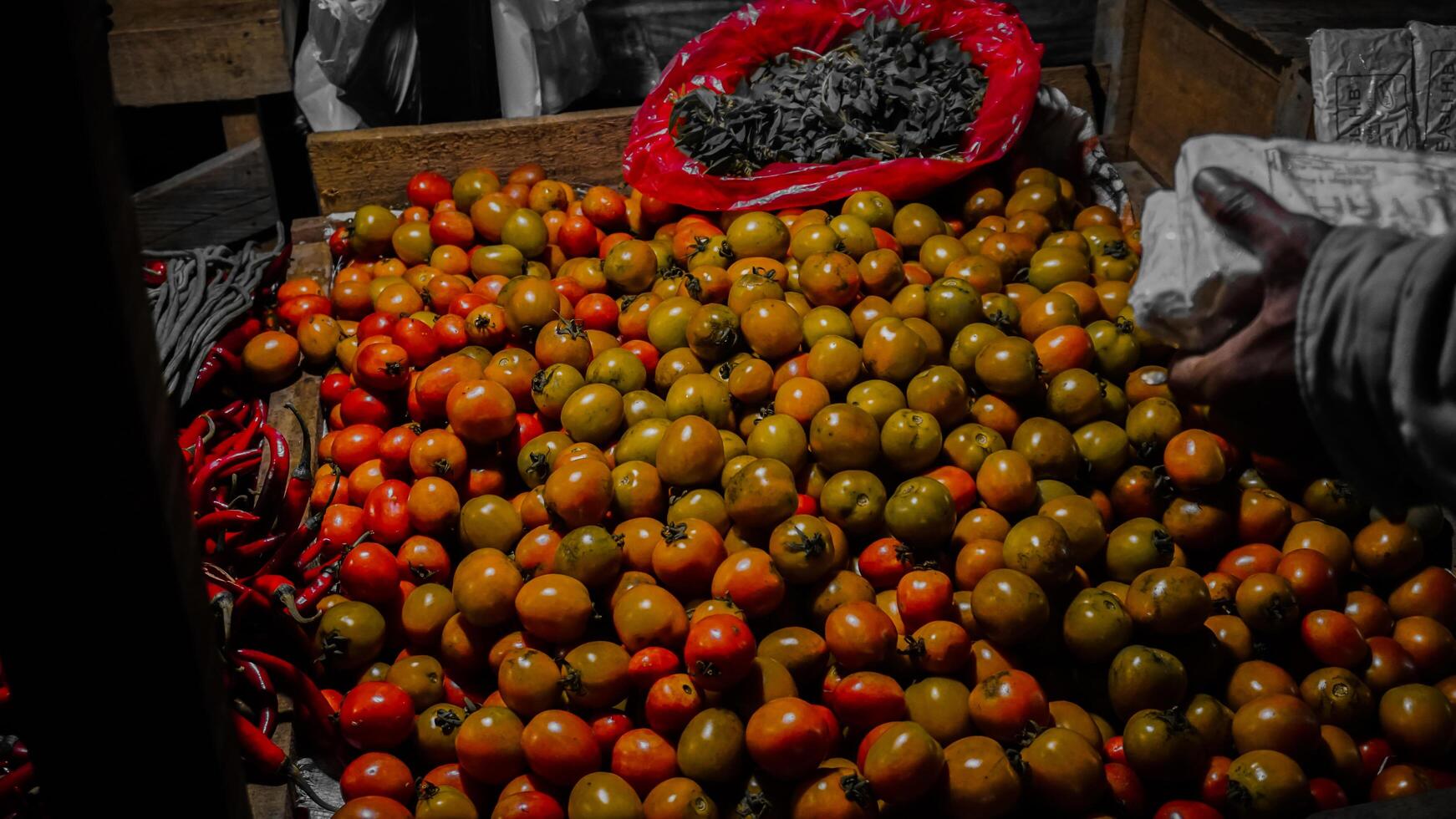 Fresh Tomatoes and Chili Peppers at Market Stall photo