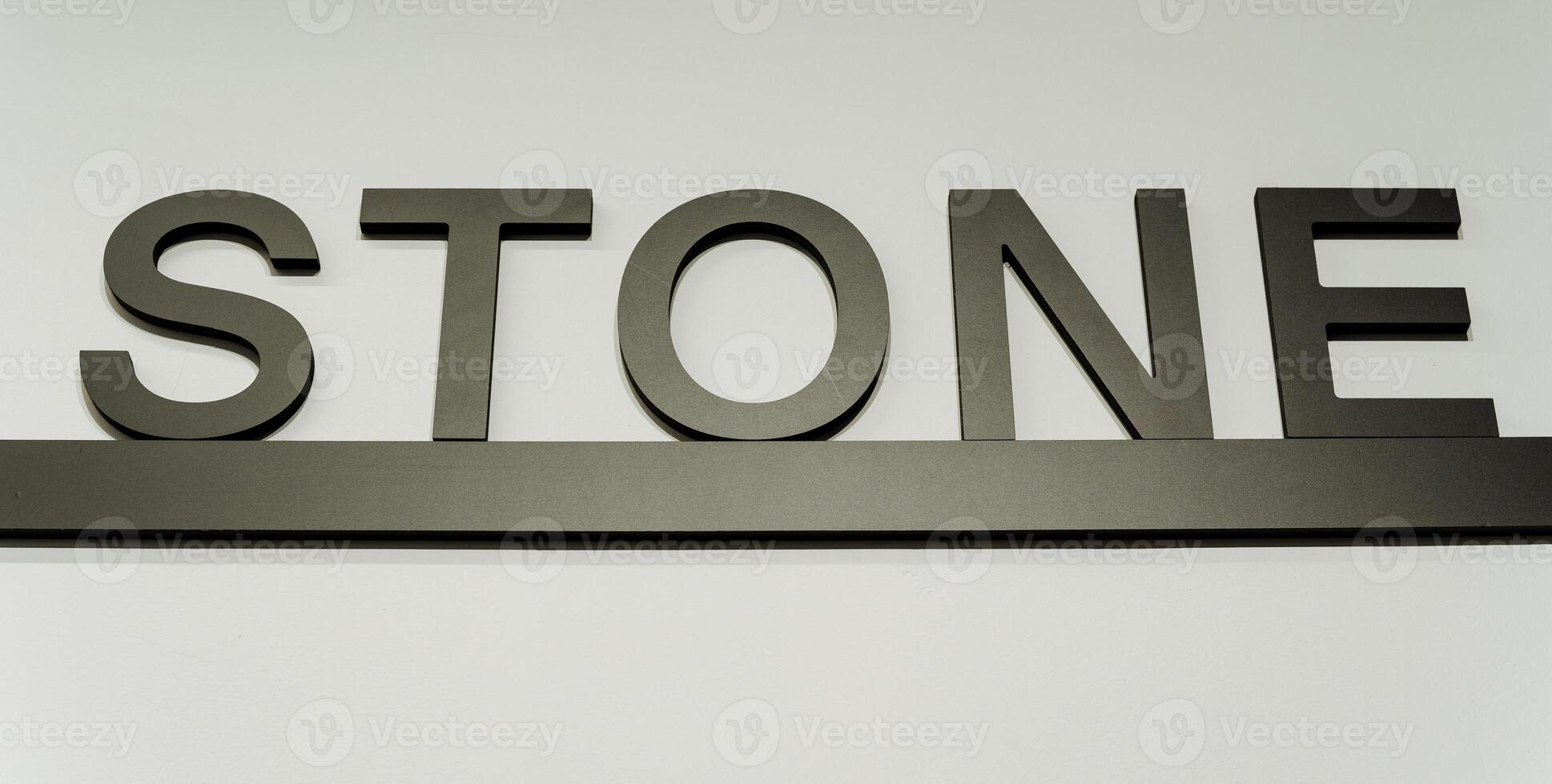 A stylish rectangular stone sign with automotive exterior details, metal, brand logo, and signage graphics against a white background, perfect for an automotive setting photo