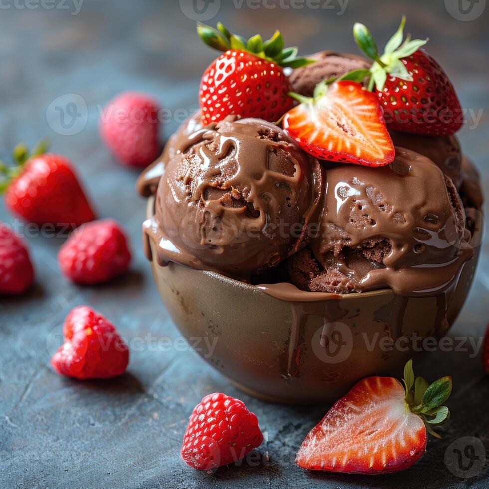 Chocolate ice cream topped with fresh strawberries photo