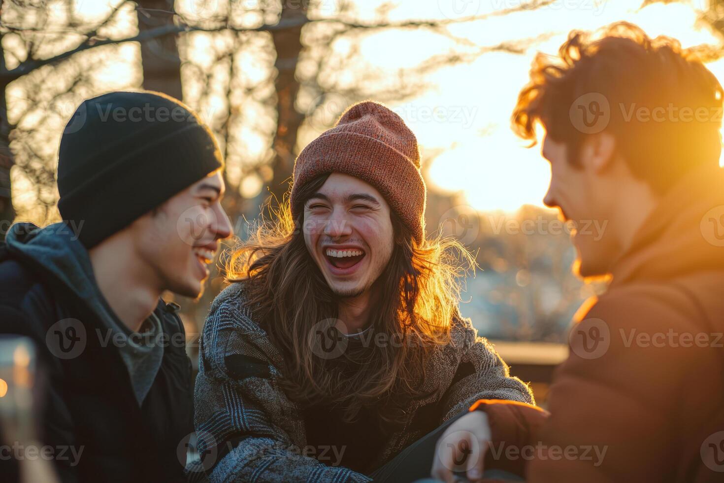 Friends laughing together in outdoor setting, showcasing deep emotional connection and strong bond photo