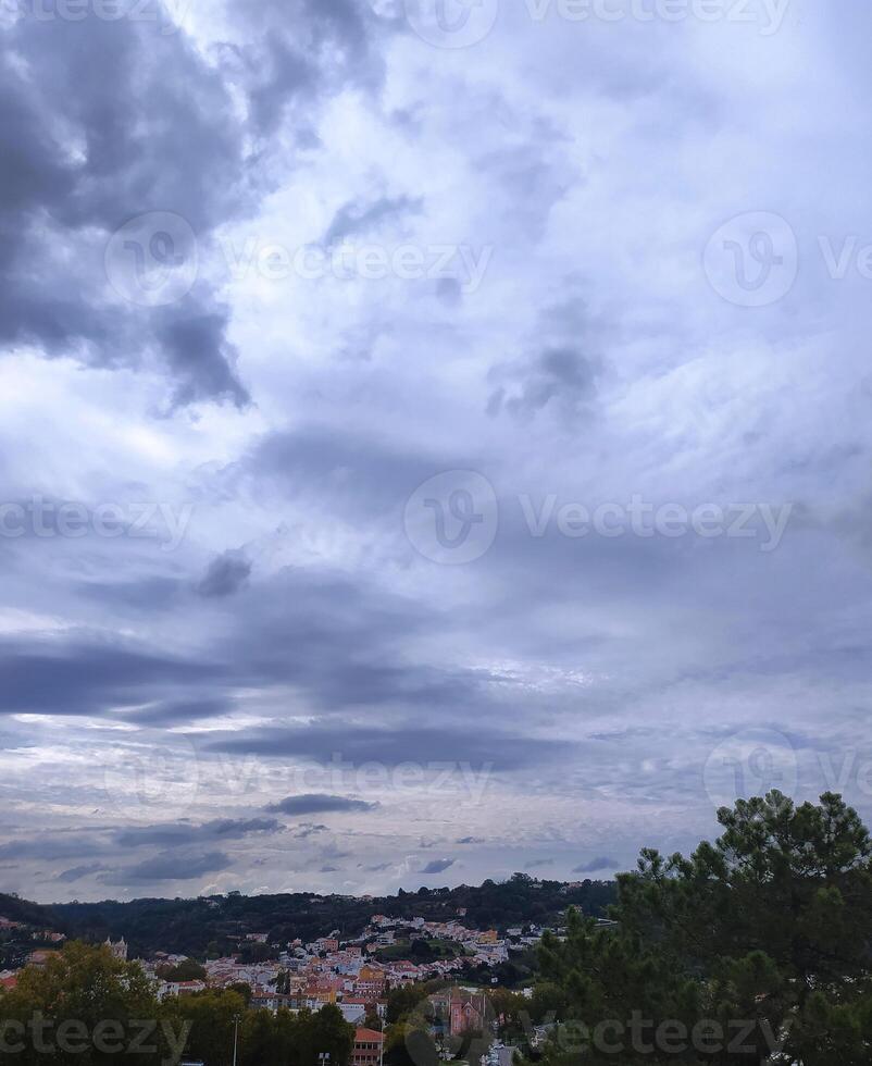 Dramatic cloud formations over e town in the late afternoon sunlight highlighting the landscape's beauty photo