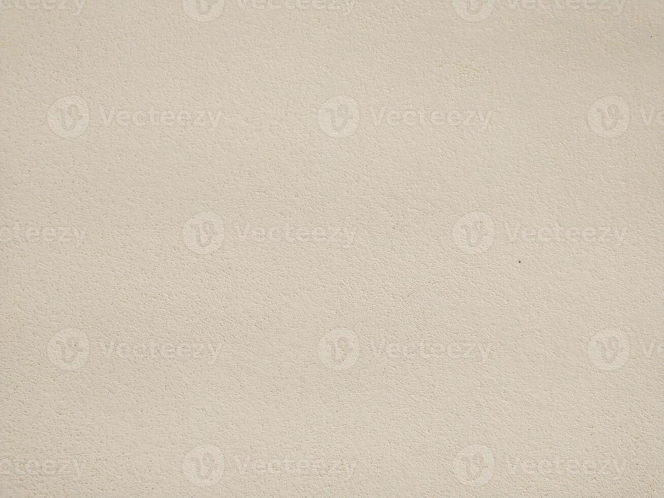 Highresolution image of a neutral beige textured wall. Perfect for backgrounds, website design, or architectural presentations. Subtle texture adds visual interest without distraction. photo