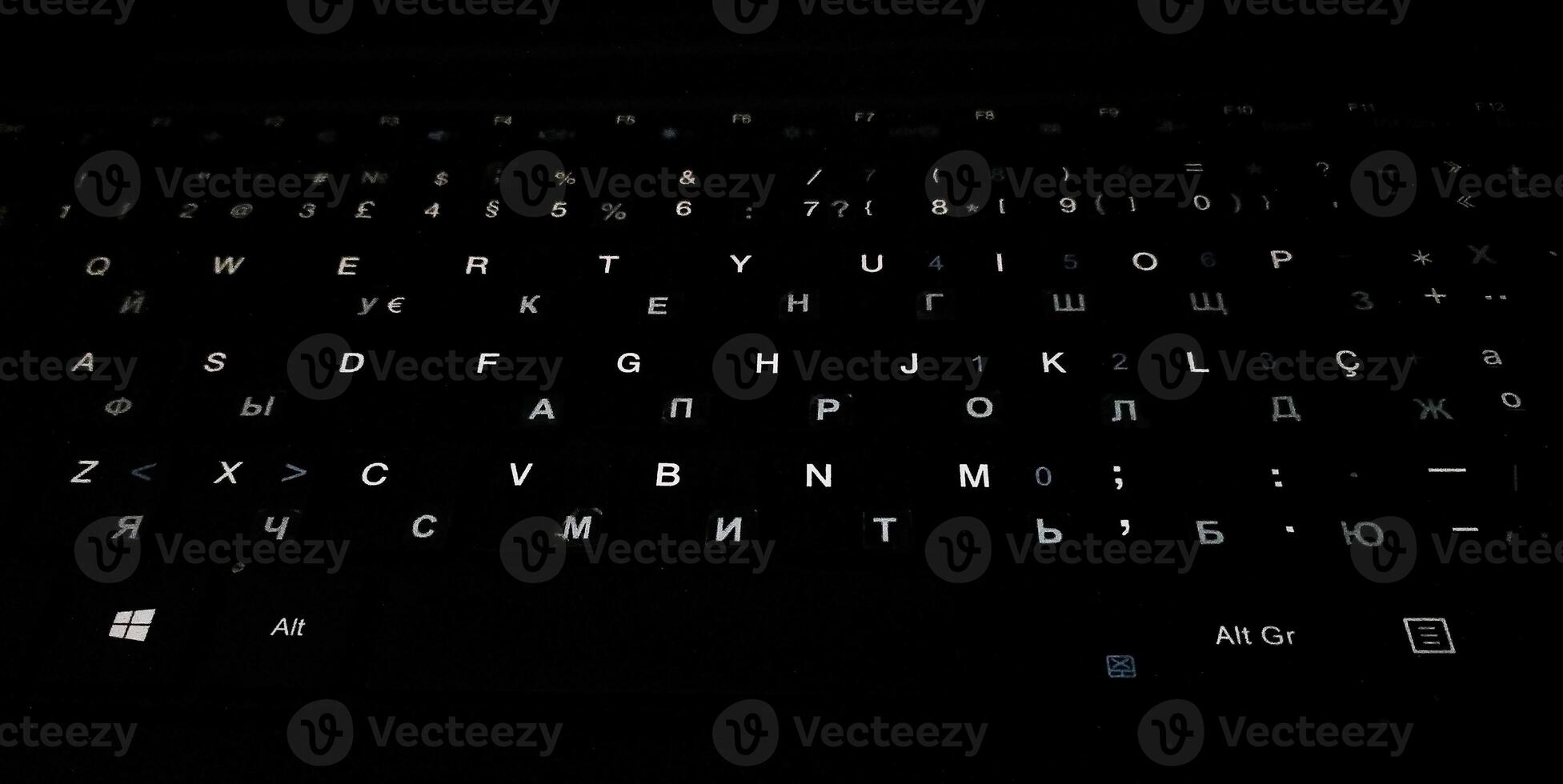 Mysterious closeup of a dark keyboard with subtly glowing keys, ideal for tech, blogging, or cybersecurity concepts. photo
