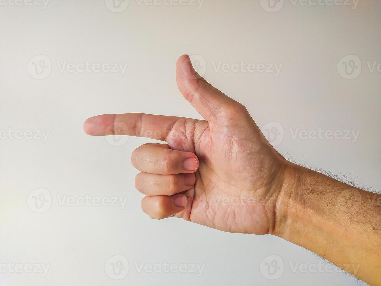 Closeup of a male hand gesturing, pointing with index finger. Clean, simple background ideal for presentations, websites, or instructional materials. Versatile image for various design projects. photo