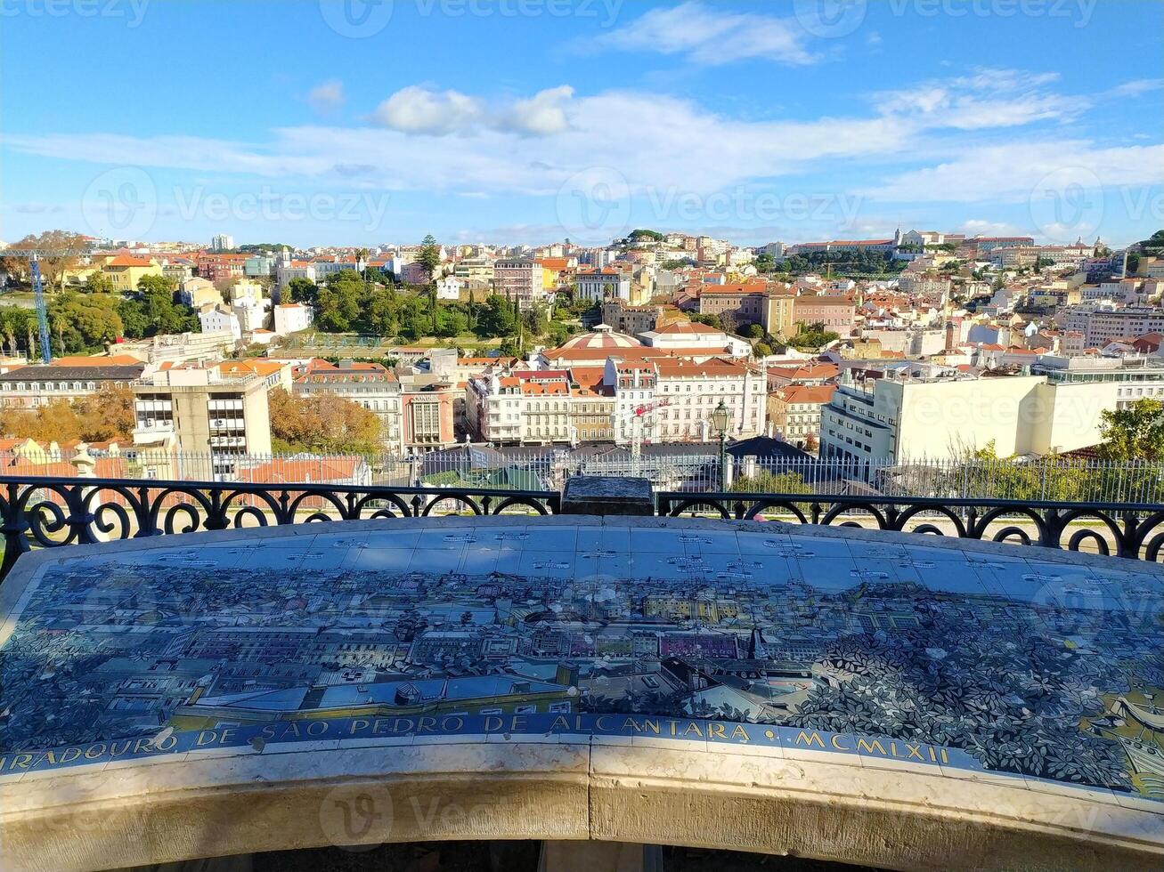 Panoramic Lisbon view from Miradouro de Sao Pedro de Alcantara with tiled map. photo