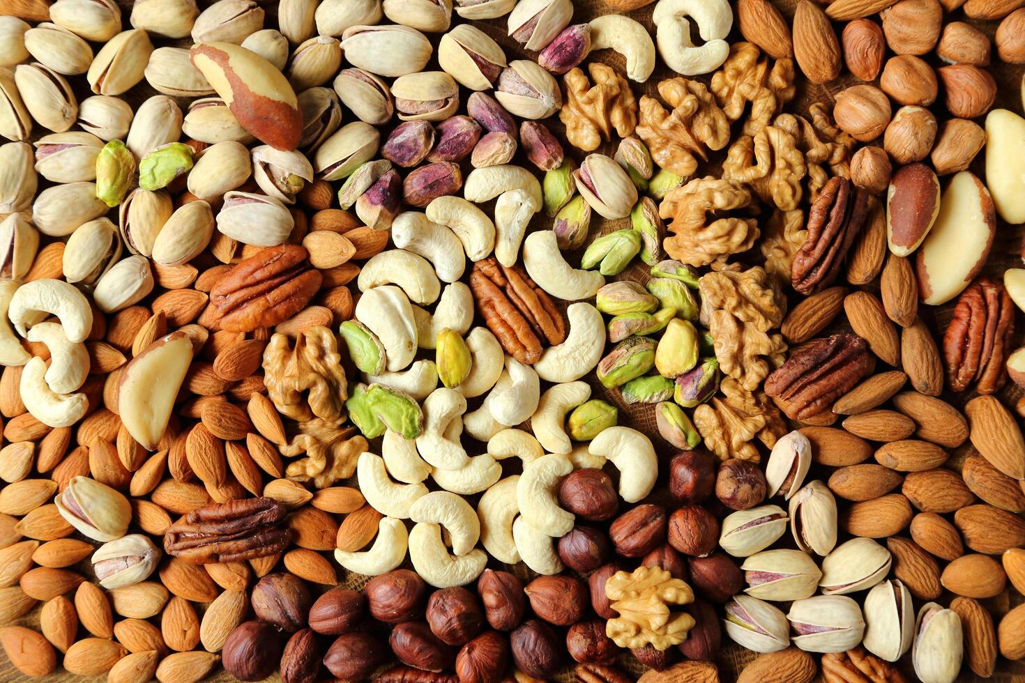 Nuts and seeds are arranged in a pile photo