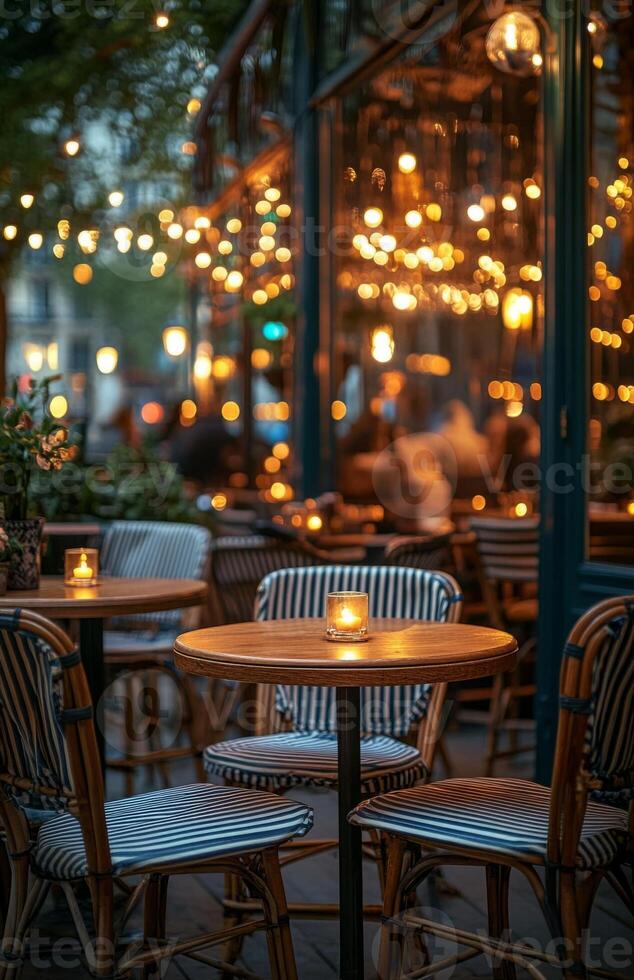 A restaurant with tables and chairs at night photo
