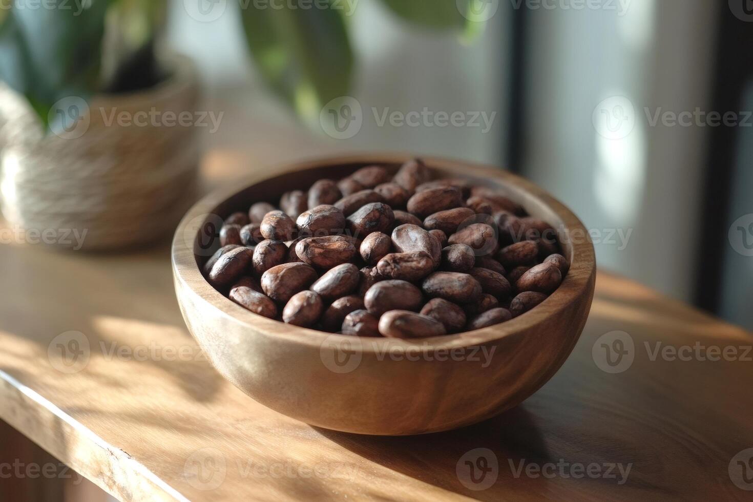 Wooden bowl brimming with aromatic cocoa beans on a table photo