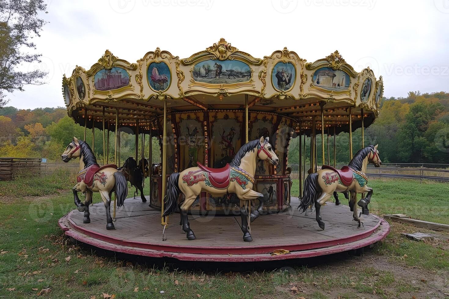 Vintage carousel with horses in autumnal park setting photo