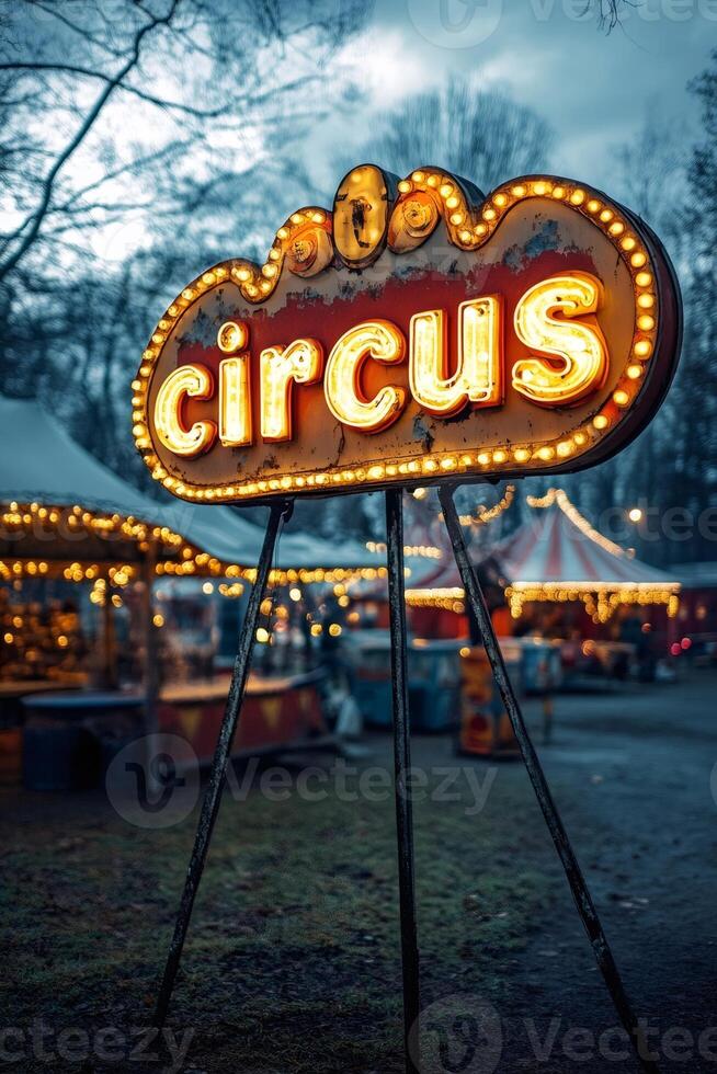 Illuminated circus sign stands tall against twilight sky photo