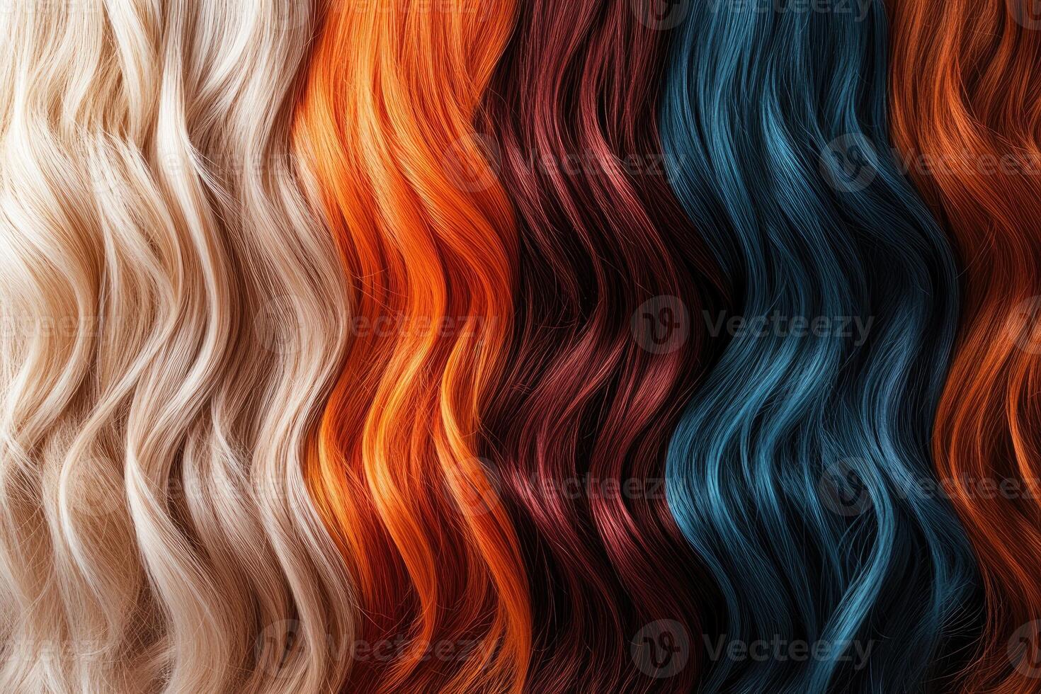 Colorful hair extensions showing a gradient of trendy colors, from teal to orange, pink and black. photo