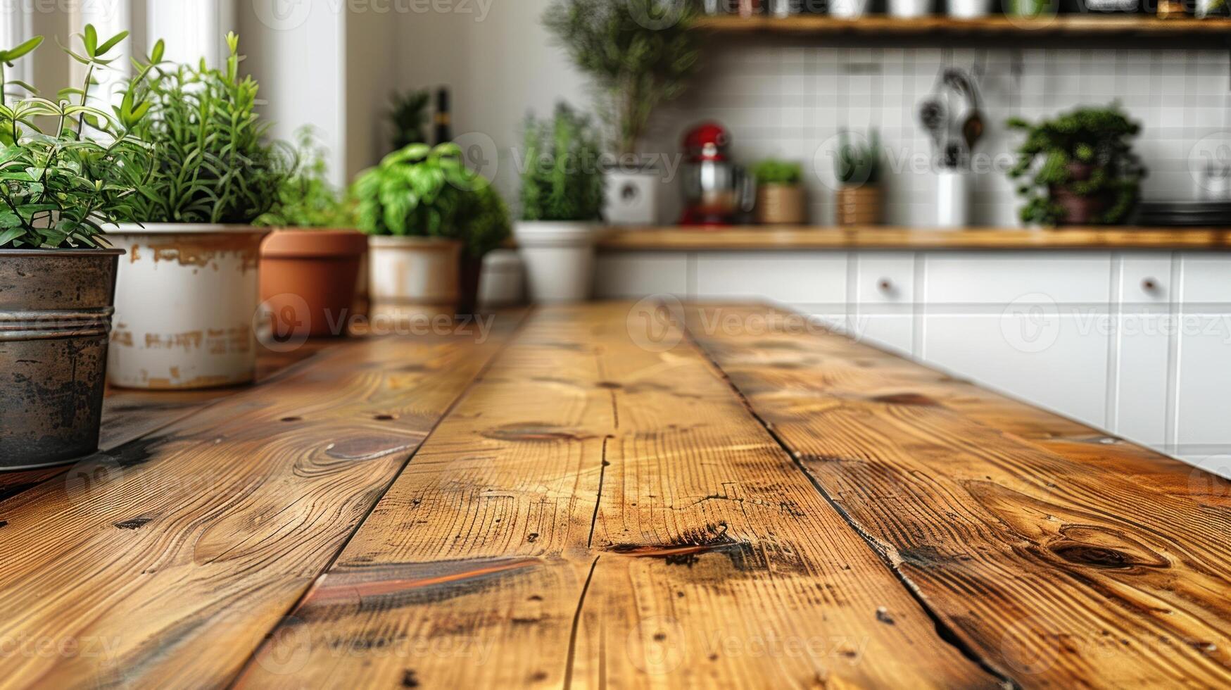 A close-up of a rustic wooden kitchen table with potted herbs photo