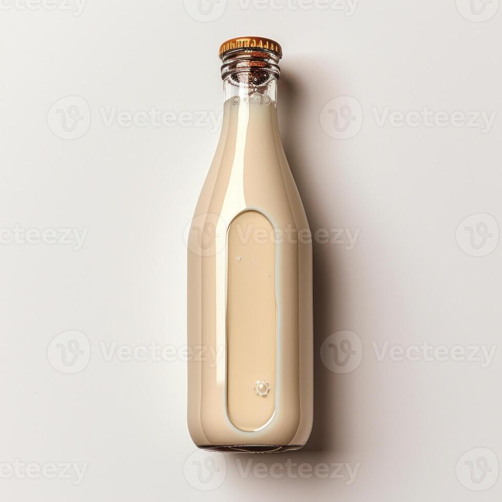 A glass bottle filled with a creamy liquid sits on a white background photo